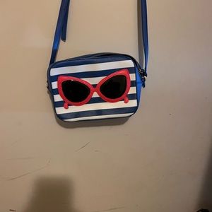 Like new Kate Spade Striped Bag With Sunglasses on one side